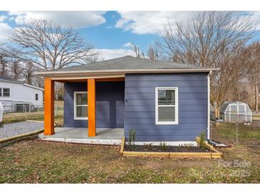 Newly renovated home featuring a charming front porch and updated exterior at 503 Birch St, Lowell, NC 28098