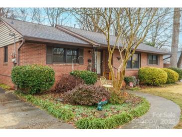 Brick ranch house with landscaped yard and walkway at 535 Tyson St, Charlotte, NC 28209