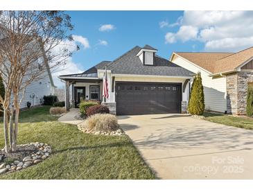 Craftsman style home with a 2 car garage and landscaped front yard at 6297 Raven Rock Dr, Denver, NC 28037