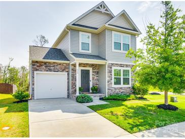 Two-story house with gray siding, stone accents, and a landscaped lawn at 970 Bunker Trce, Rock Hill, SC 29730