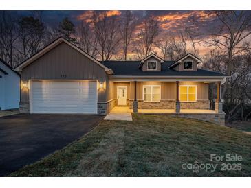 Two-story house with gray siding, stone accents, and a covered porch at 113 Brentwood Dr, Maiden, NC 28650