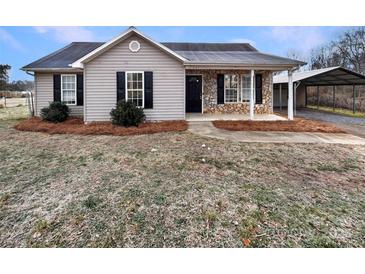 Charming one-story house with stone accents and a covered porch at 3164 River Rd, Lincolnton, NC 28092