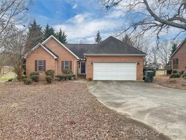 Brick ranch home with attached garage and spacious yard at 1107 Phifer Rd, Kings Mountain, NC 28086