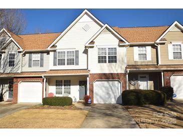 Two-story townhome with brick facade and attached garage at 11646 Rabbit Ridge Rd, Charlotte, NC 28270