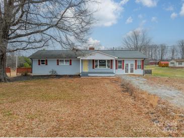 Charming single-story home with light blue siding and a red trimmed porch and shutters at 1486 Amity Church Rd, Denver, NC 28037