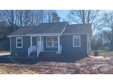 Newly constructed gray house with white accents and a small front porch at 368 Luther Scronce Rd, Vale, NC 28168