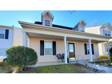 Two-story house with a covered porch and landscaping at 8024 Bronze Pike Dr, Charlotte, NC 28273