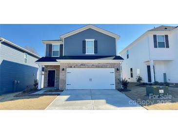 Two-story house with gray siding, brick accents, and a two-car garage at 1260 31St Ne St, Hickory, NC 28613