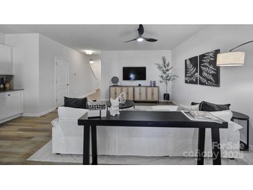 Bright living room with modern furniture and hardwood floors at 176 Briana Marie Way, Indian Trail, NC 28079