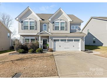 Two-story house with gray siding, white trim, and a two-car garage at 2262 Galloway Sw Ln # 330, Concord, NC 28025