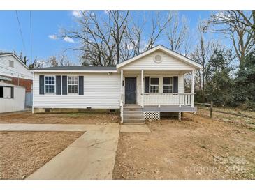 Charming one-story home with a front porch and landscaping at 2331 Celia Ave, Charlotte, NC 28216