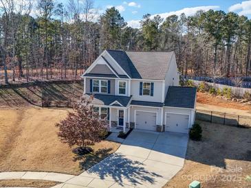 Two-story house with a two-car garage, and a landscaped yard at 2841 Kinloch Ct, Clover, SC 29710