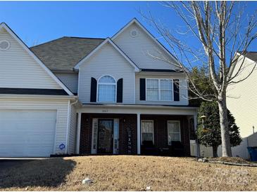 Charming two-story home featuring a brick porch and a manicured front lawn at 3865 Parkers Rd, Fort Mill, SC 29715