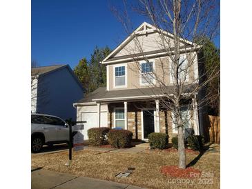 Two-story house with stone accents and a landscaped yard at 4152 Broadstairs Sw Dr, Concord, NC 28025