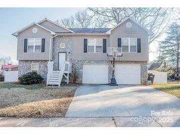 Two-story house with stone accents, double garage, and basketball hoop at 520 5Th Se Ave, Hickory, NC 28602