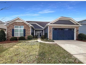 Inviting ranch home with stone accents and a two-car garage at 9140 Carneros Creek Rd, Charlotte, NC 28214