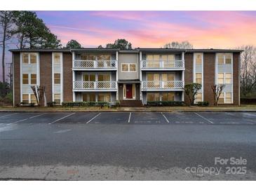 Brick building exterior with parking and landscaping at 9325 Old Concord Rd # C, Charlotte, NC 28213