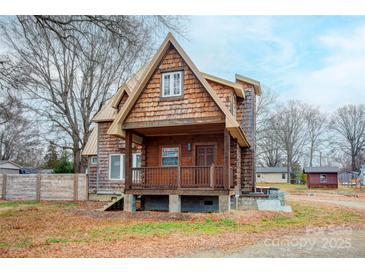 A charming A-frame home with wood siding and a spacious deck at 1505 S Ridge Ave, Kannapolis, NC 28083