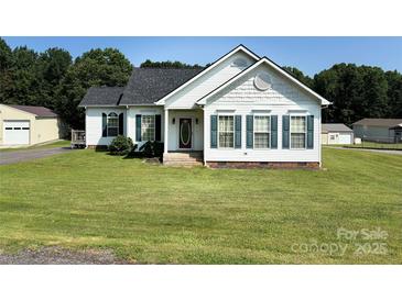 Charming single-story home featuring a well-manicured front yard, red door, and classic shutters at 6328 W Nc 10 Hwy, Hickory, NC 28602