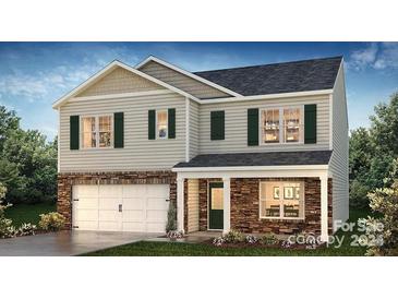 Charming two-story home with stone accents, green shutters, a front lawn, and a two-car garage at 768 14Th Avenue Ne Ct, Hickory, NC 28601