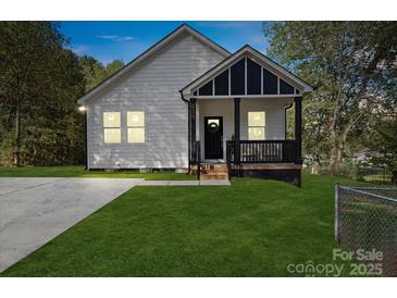 Charming craftsman style home with a front porch and landscaped lawn at 109 E Broad St, Salisbury, NC 28144