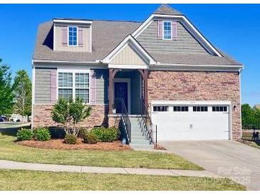 Charming two-story home with brick and siding, well-maintained lawn, and two-car garage at 1605 Appledale Ct # 116, Fort Mill, SC 29715