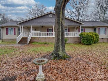 Ranch-style home with covered porch and landscaped yard at 177 Jim Hanna Ln # 4510, Wadesboro, NC 28170