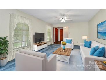 Living room with light blue carpet and modern furniture at 1801 Windsor Dr, Lancaster, SC 29720