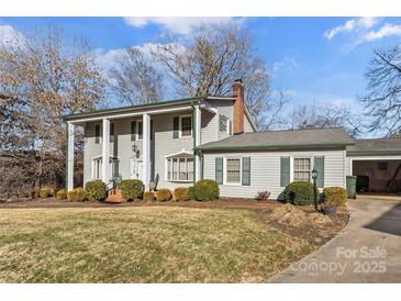 Ranch style home with mature landscaping and a spacious yard at 1968 12Th Street Ne Pl, Hickory, NC 28601