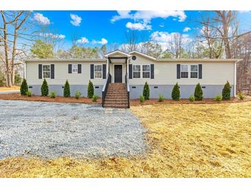 Charming single-story home featuring a well-maintained lawn and inviting entrance stairs at 4105 Glenola Dr, Waxhaw, NC 28173