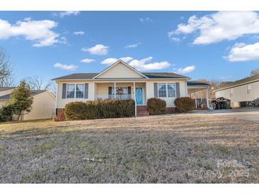 Ranch style home with front porch and landscaping at 603 Helms Dr, Lowell, NC 28098