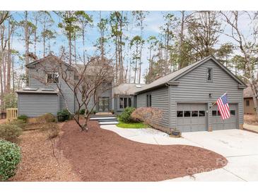 Gray two-story house with attached two-car garage and landscaped yard at 126 Tall Pines Ct, Lake Wylie, SC 29710