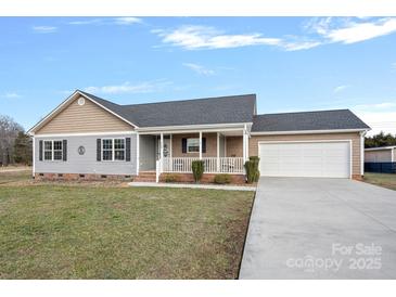 Ranch style home with gray siding, attached garage, and a porch at 130 Portman Ln, Statesville, NC 28625