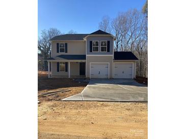 Two-story house with two-car garage and neutral colors at 1604 Lincoln Dr, Shelby, NC 28152