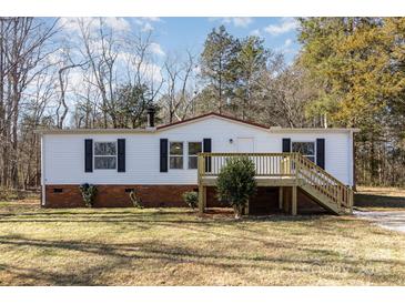 Newly renovated mobile home with deck and landscaped yard at 1762 Proposal Ave, Chester, SC 29706