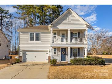 Two-story house with gray siding, a two-car garage, and a front porch at 232 Morgans Branch Rd, Belmont, NC 28012