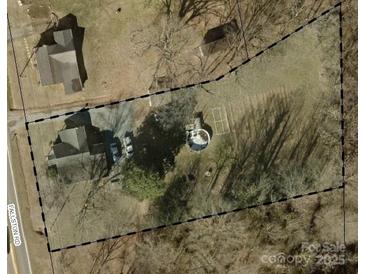 Aerial view of house, driveway, and backyard with above-ground pool at 4136 Fallston Rd, Shelby, NC 28150