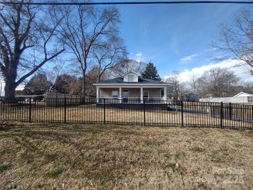 Cute bungalow with a front porch and a fenced yard at 1443 Modena St, Gastonia, NC 28054