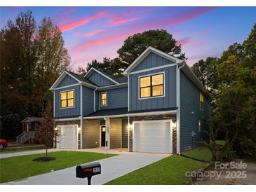 Modern two-story home with gray siding and a two-car garage at 2029 Tom Sadler Rd, Charlotte, NC 28214