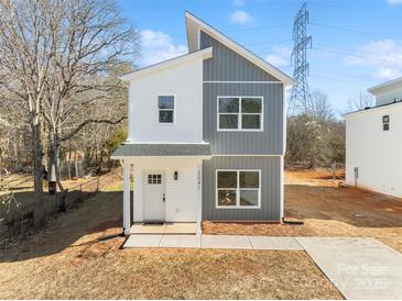 Modern two-story home with gray and white exterior, and a small front yard at 2041 Greenoak Dr, Shelby, NC 28152