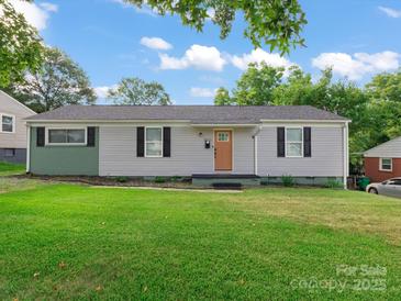 Charming single-story home with a well-maintained lawn and neutral siding, perfect for first-time buyers at 3021 Botany St, Charlotte, NC 28216