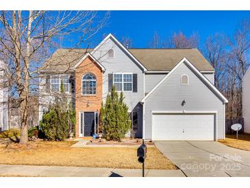 Two-story house with brick and siding, two-car garage, and landscaping at 1317 New Life Rd, Charlotte, NC 28216