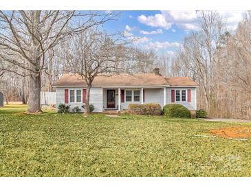 Ranch home with covered porch, and a spacious yard at 3015 Pageland Hwy, Lancaster, SC 29720