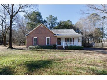 Brick ranch home with front porch and landscaped yard at 3035 Chapel View Ct, Rock Hill, SC 29732