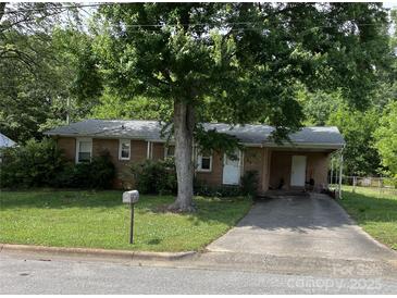 Brick ranch house with carport and mature landscaping at 312 Fulton St, Kings Mountain, NC 28086
