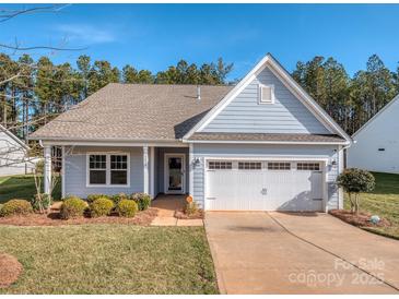 Nice curb appeal! Light blue house with 2 car garage and landscaping at 5220 Admirals Lndg, Lancaster, SC 29720