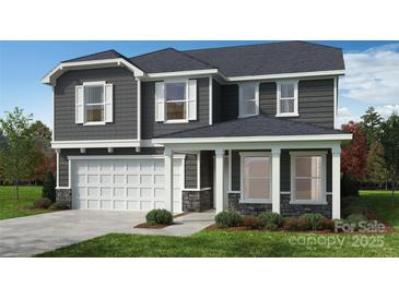 Two-story house with gray siding, white trim, and a two-car garage at 1016 Farm Branch Ct, Indian Trail, NC 28079