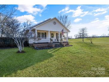 Charming white house with a brick porch and a well-maintained lawn at 2961 Great Falls Hwy, Lancaster, SC 29720