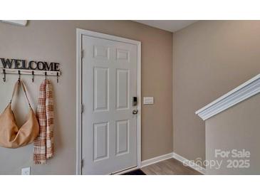 Inviting entryway with coat hooks and stylish decor at 3024 Ora Smith Rd, Lincolnton, NC 28092