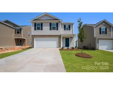 Charming two-story home featuring a two-car garage and well-maintained lawn in a suburban neighborhood at 3032 Ora Smith Rd, Lincolnton, NC 28092